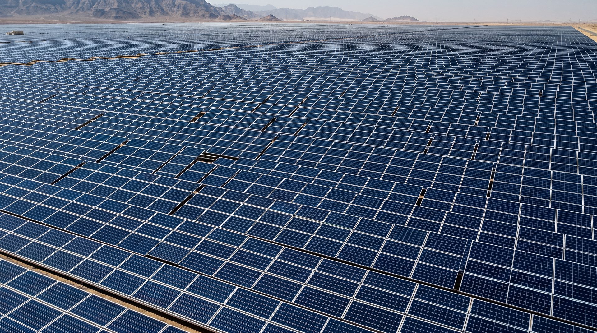 Aerial view of a massive solar panel array in the desert.